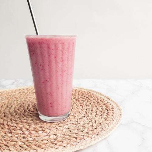 Tall glass of Strawberry Banana Smoothie Without Yogurt.