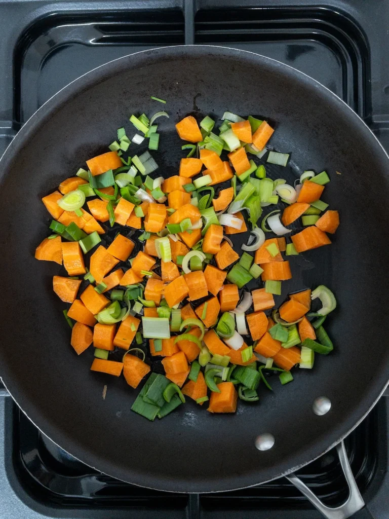 Vegetables cooking in a frying pan. Ingredients for Chicken and Dumplings