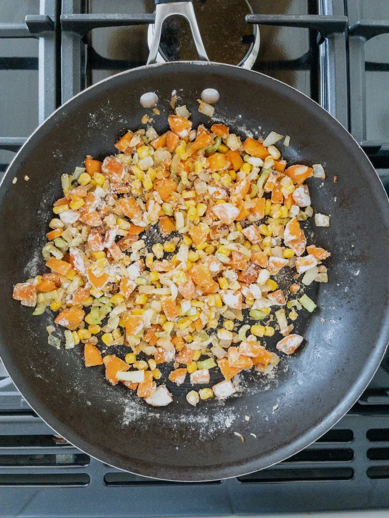 The vegetables cooking for the filling of dairy free chicken pot pie recipe