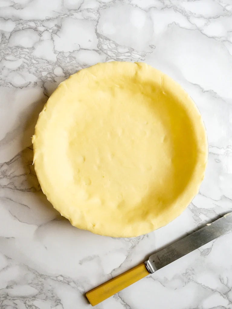 Shortcrust pastry in pie dish, ready for the dairy free chicken pot pie filling