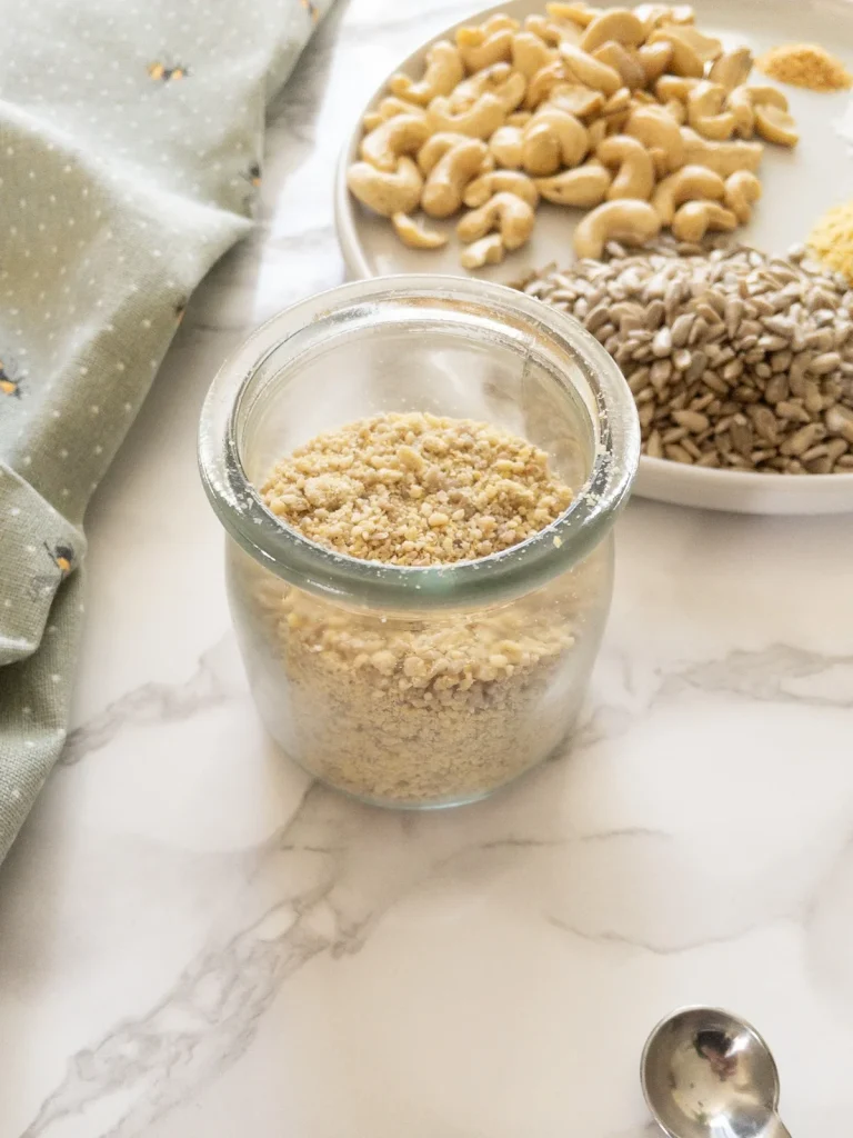 Dairy Free Parmesan recipe made with cashews, sunflower seeds and nutritional yeast.