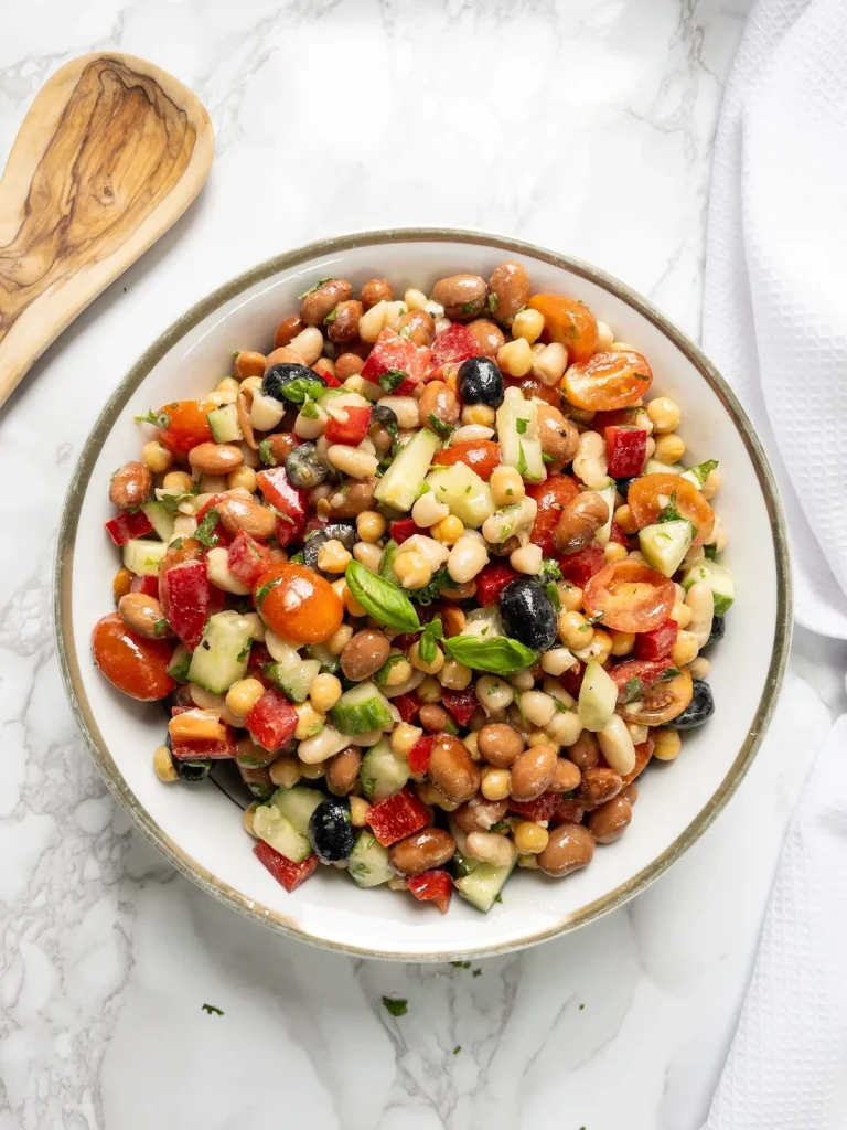 Mediterranean vegan bean salad with chickpeas and dressing.