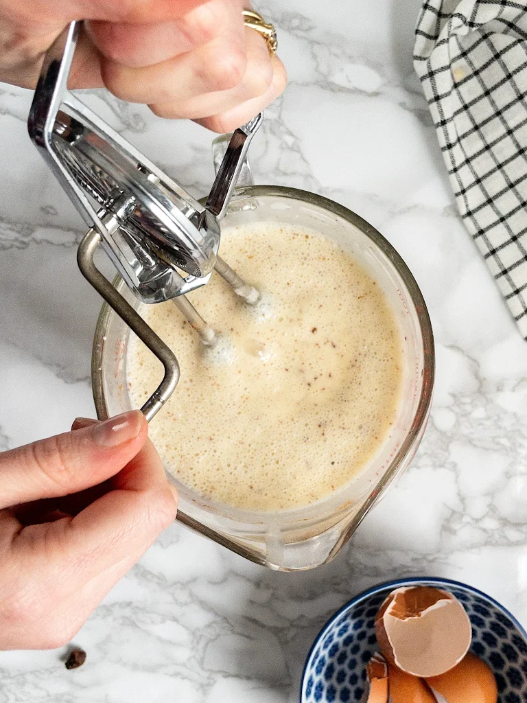 Pudding mixture in a jug for Dairy Free Bread Pudding 