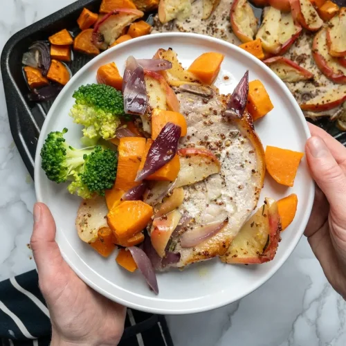 Honey mustard pork chops served with roasted sweet potatoes and apples.