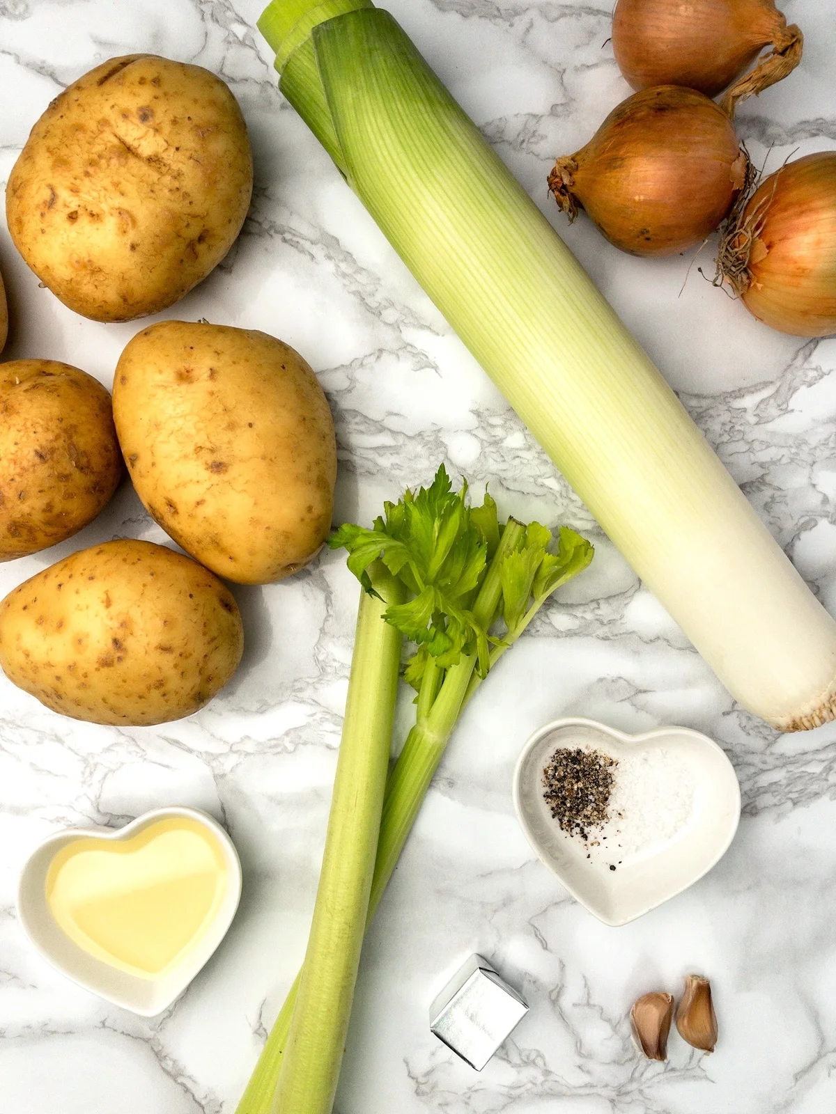 Leeks, potatoes, onions and other ingredients for making this soup recipe.