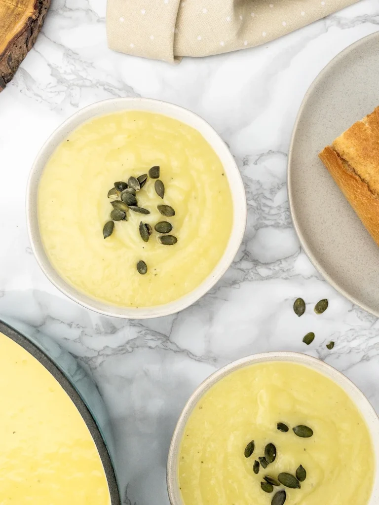 Bowls of hearty soup with bread.