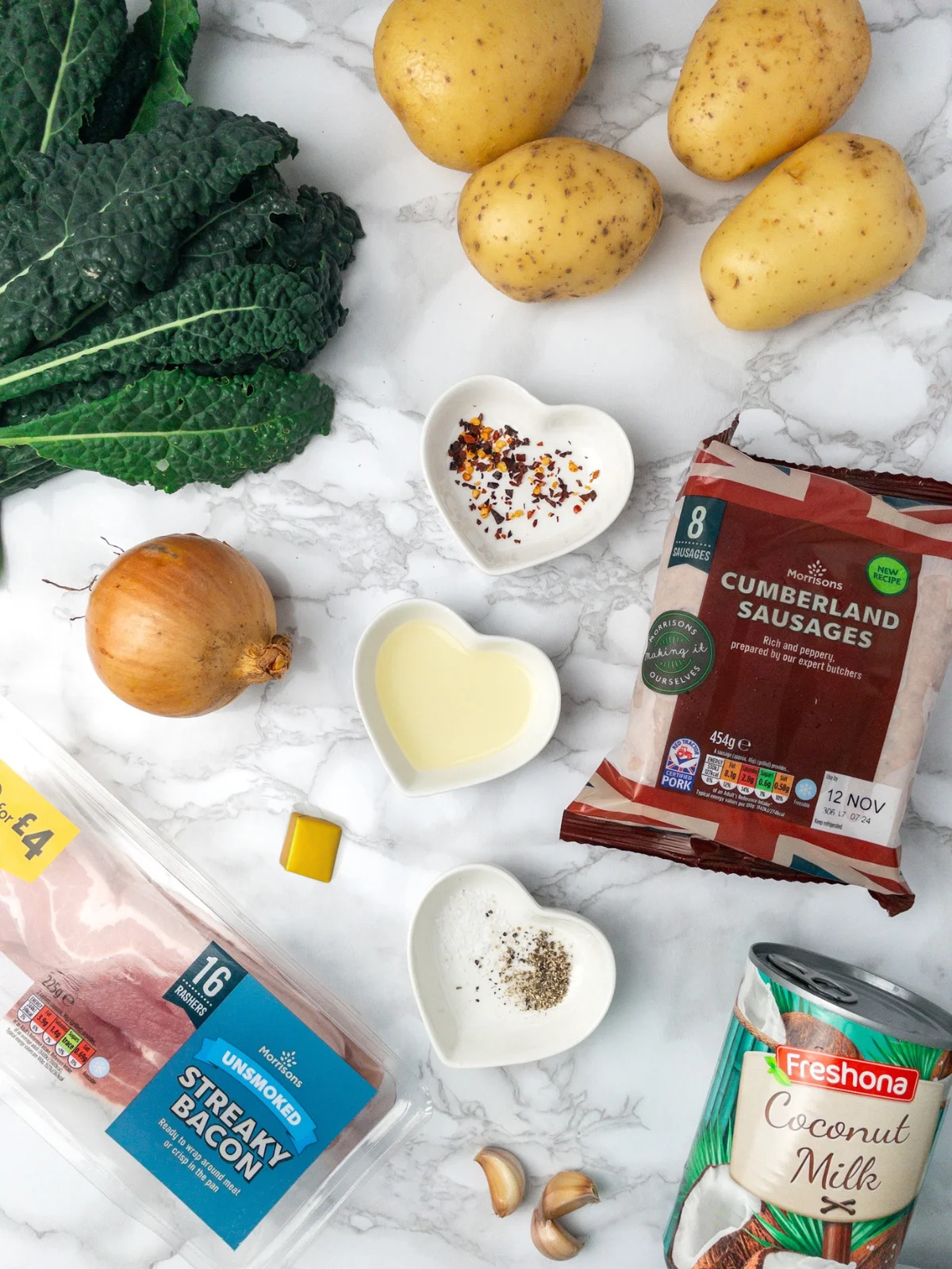 Ingredients for dairy free Zuppa Toscana soup, including potatoes, sausage, kale and coconut milk.