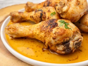 Close-up of pan fried chicken drumsticks