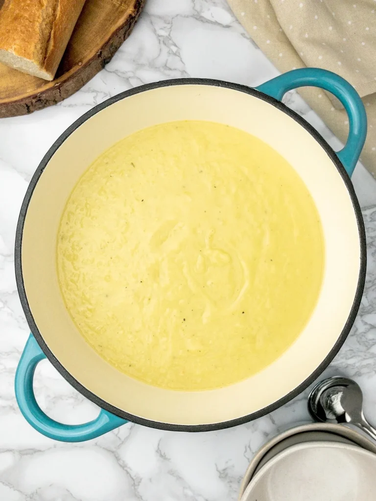 Creamy leek and potato soup in a pot.