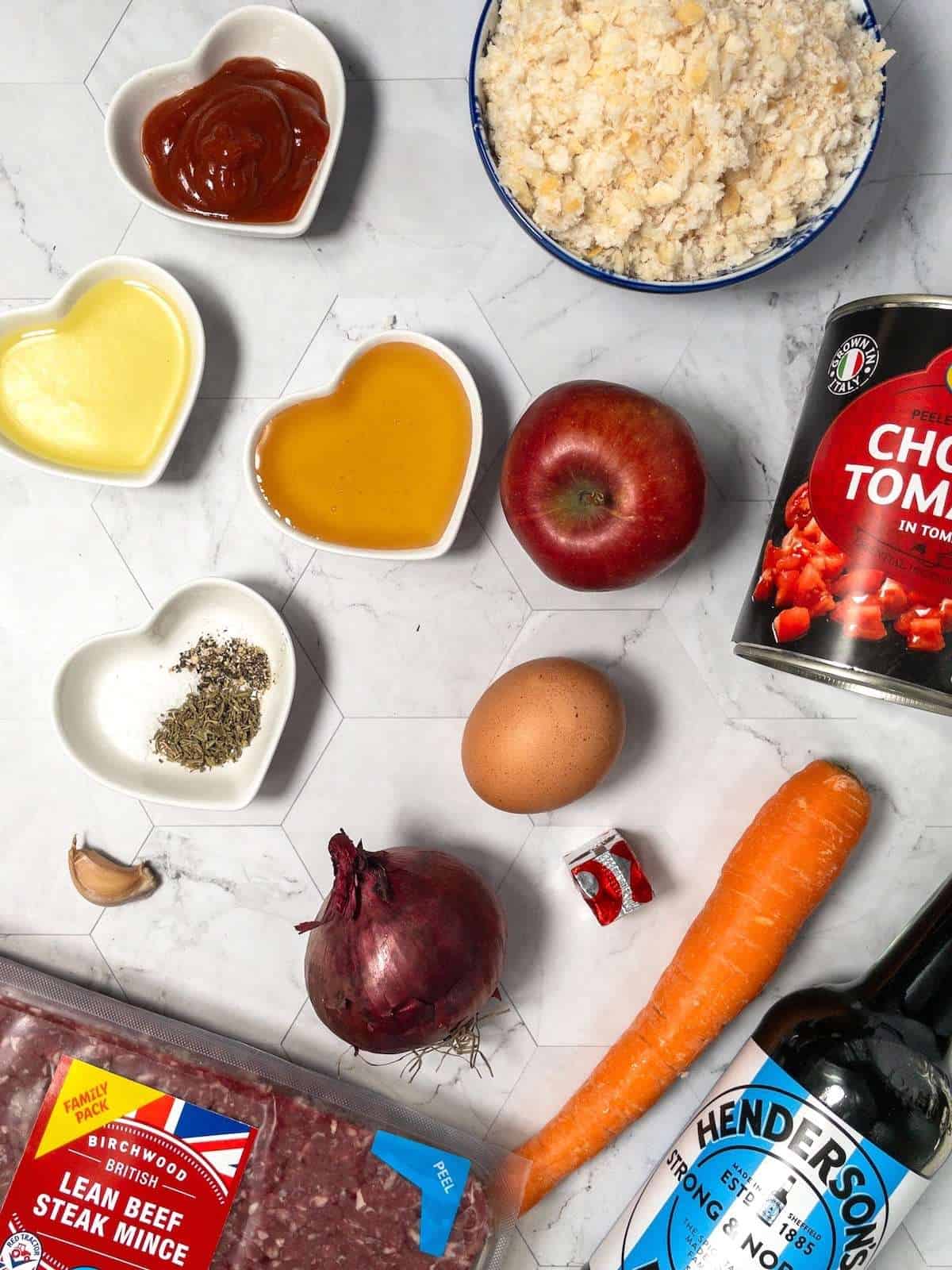 Ingredients for meatloaf made without milk, including beef, apple, breadcrumbs and honey.