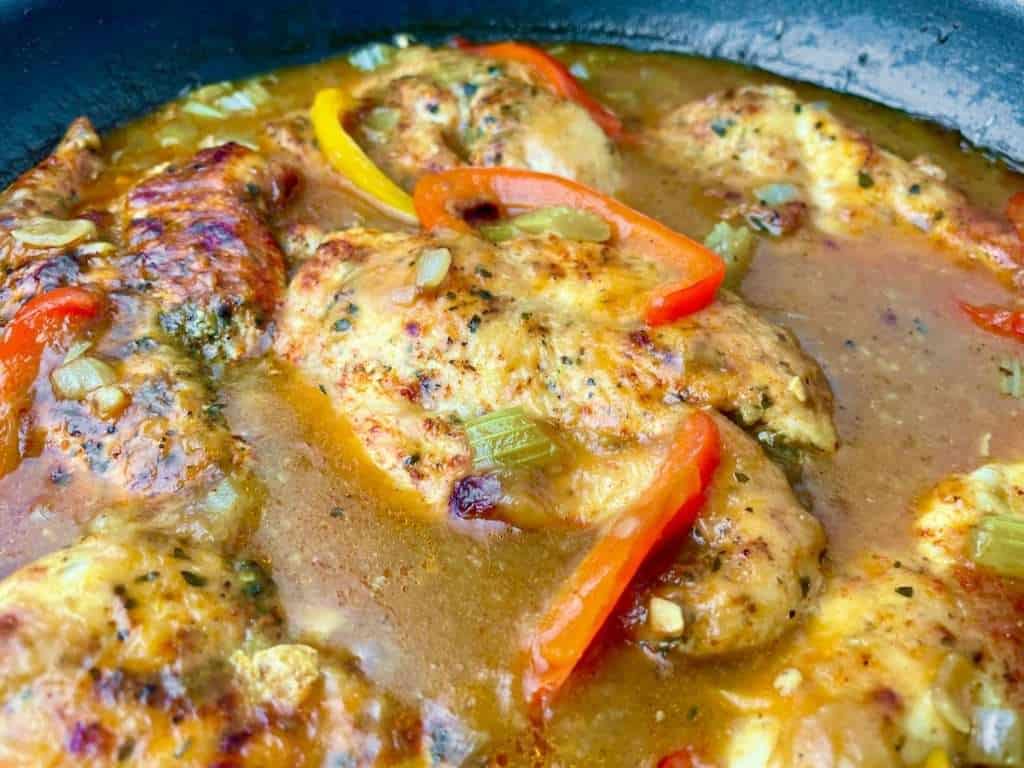 Skillet of Cajun chicken with a flavorful gravy