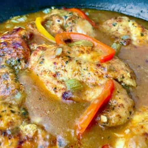 Skillet of Cajun chicken with a flavorful gravy