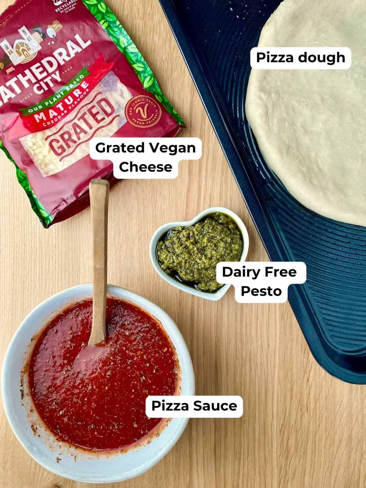 Ingredients for homemade dairy-free pizza on a countertop.